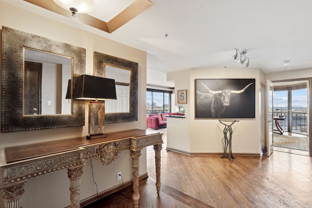 corridor featuring hardwood / wood-style floors