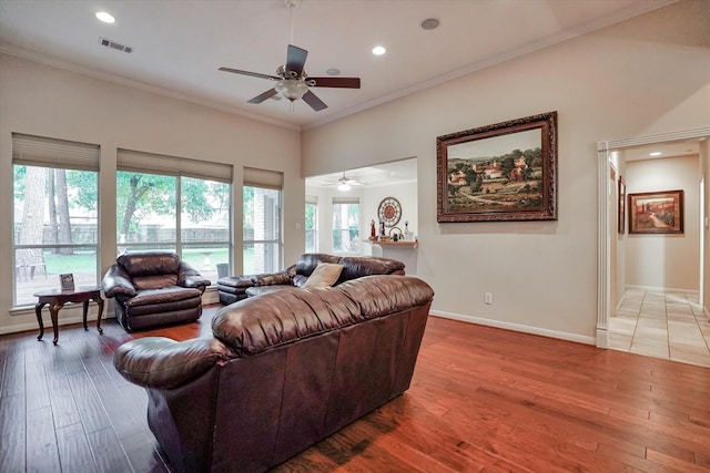 living room with crown molding, hardwood / wood-style floors, and ceiling fan