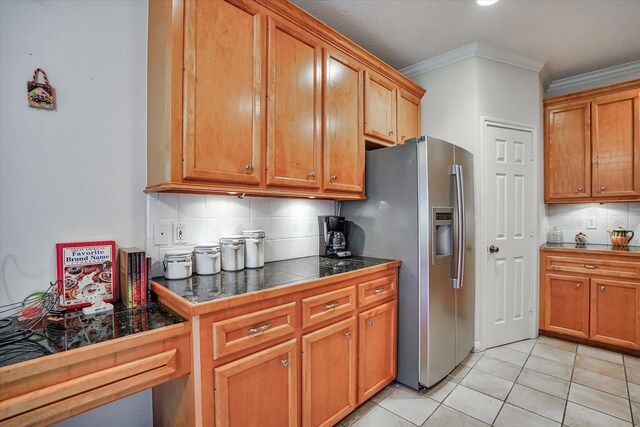 15420 Winterhaven Dr, Tomball, TX 77377 - kitchen featuring stainless steel fridge, ornamental molding, decorative backsplash, light tile patterned floors, and brown cabinets