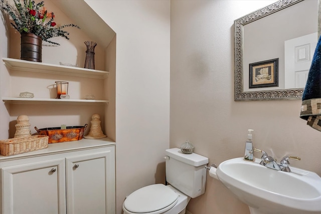 bathroom with toilet and sink