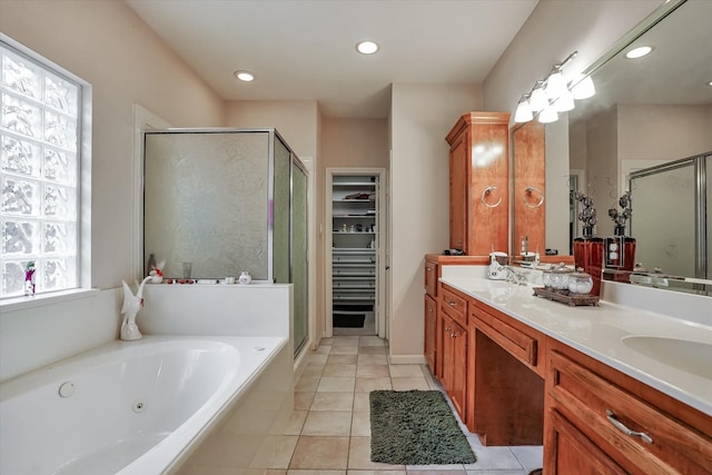 bathroom featuring vanity and shower with separate bathtub