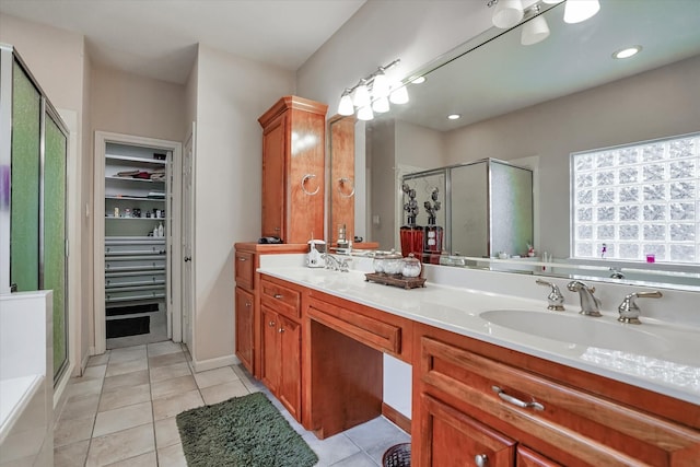 15420 Winterhaven Dr, Tomball, TX 77377 - bathroom with a shower stall, double vanity, a spacious closet, tile patterned floors, and recessed lighting