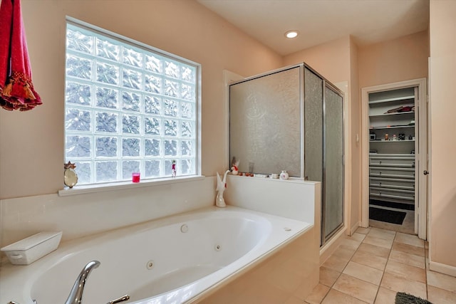 15420 Winterhaven Dr, Tomball, TX 77377 - bathroom featuring tile patterned floors, a shower stall, a tub with jets, and recessed lighting