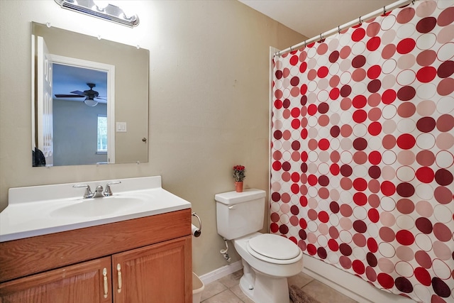 bathroom with toilet, tile patterned flooring, curtained shower, vanity, and ceiling fan