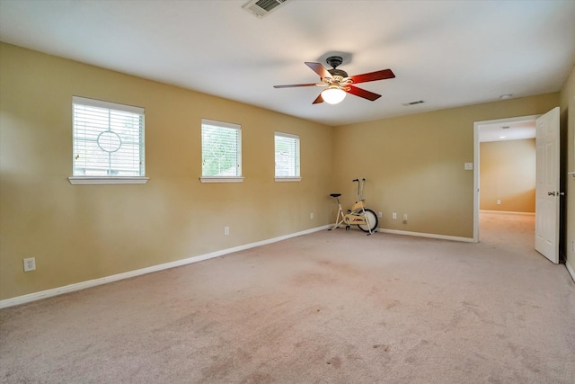 unfurnished room with light carpet and ceiling fan