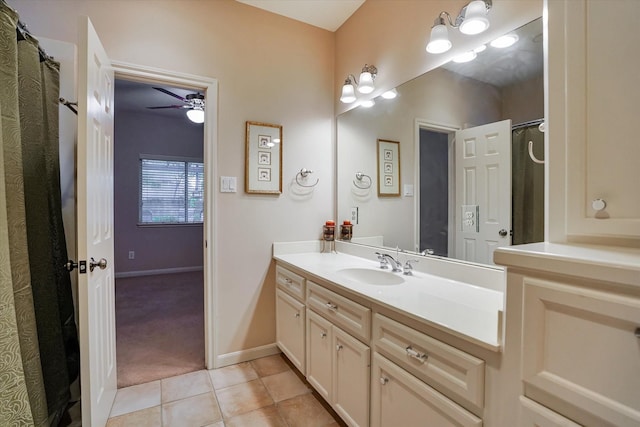 bathroom featuring vanity, ceiling fan, and tile patterned flooring