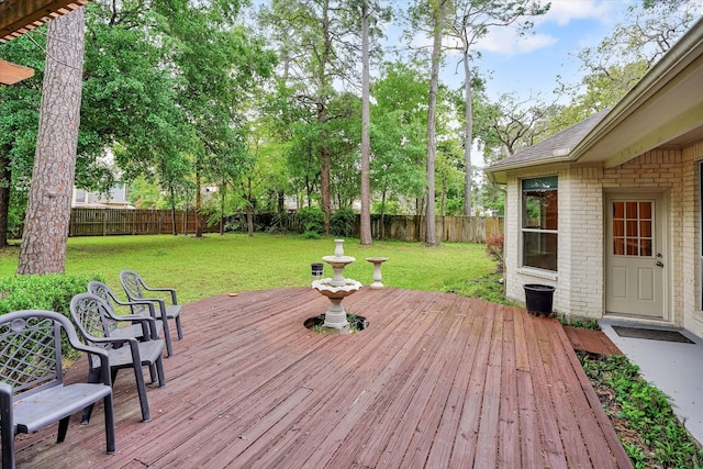 wooden terrace with a yard