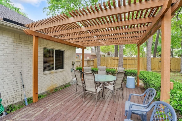 15420 Winterhaven Dr, Tomball, TX 77377 - wooden terrace featuring a fenced backyard, outdoor dining area, and a pergola