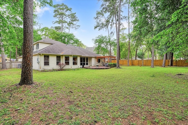 rear view of house with a lawn