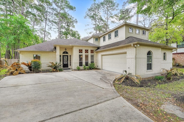 15420 Winterhaven Dr, Tomball, TX 77377 - prairie-style home featuring brick siding, driveway, a shingled roof, and an attached garage