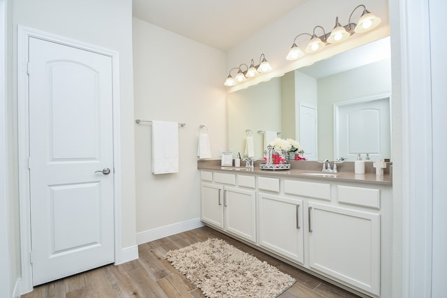 bathroom featuring vanity and hardwood / wood-style floors