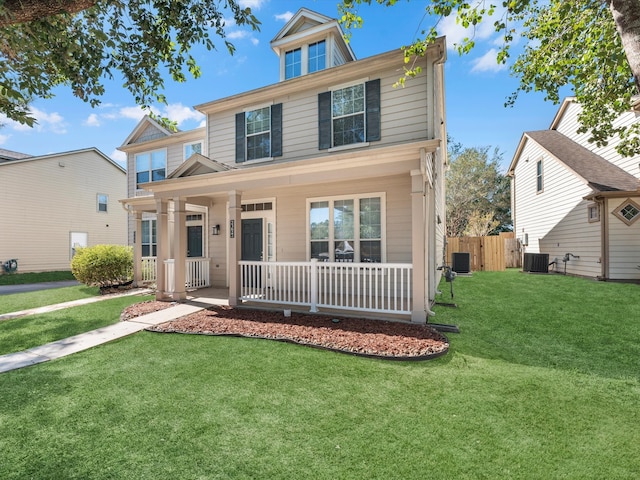 view of front of house featuring covered porch, a front lawn, and central AC unit