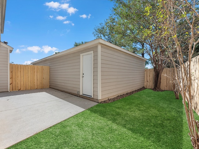 view of outdoor structure with a lawn