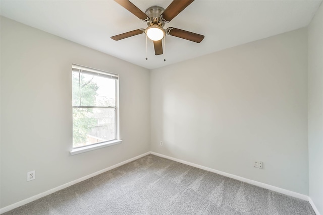 carpeted empty room with ceiling fan