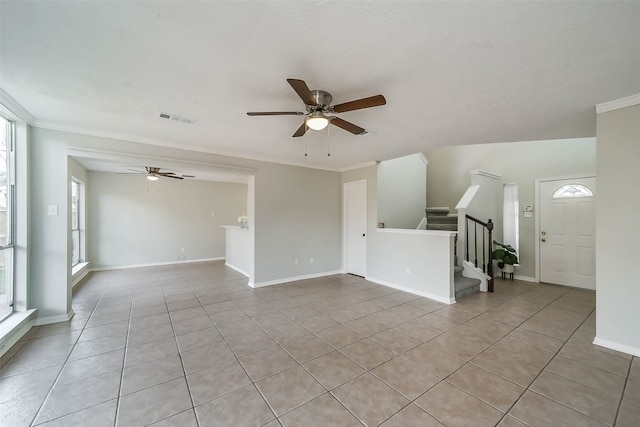 unfurnished living room featuring ornamental molding, light tile patterned floors, and ceiling fan