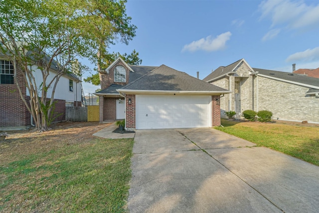 view of front of home with a front lawn and a garage