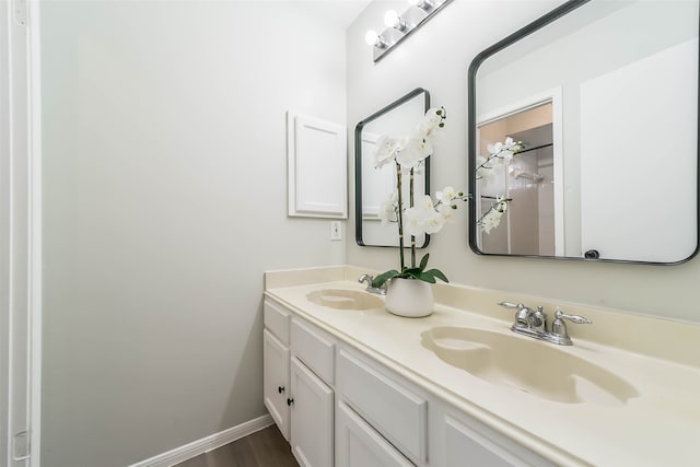 bathroom featuring vanity and hardwood / wood-style floors