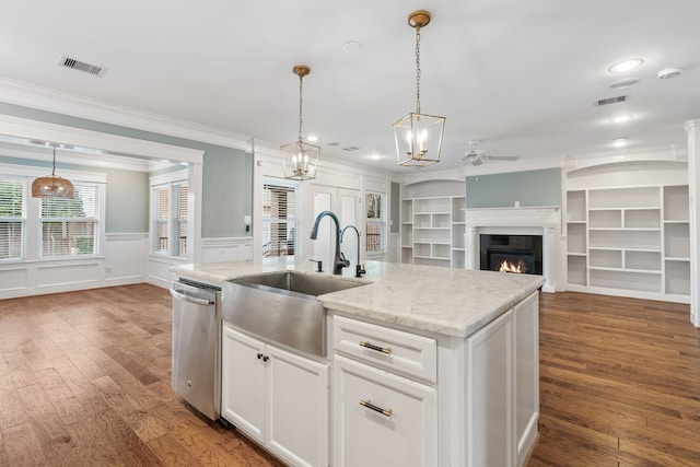 kitchen with a center island with sink, dishwasher, white cabinets, and wood-type flooring