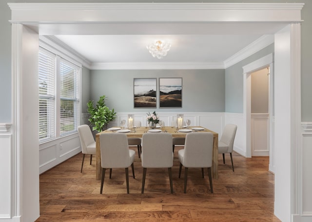 dining space with crown molding and dark hardwood / wood-style flooring