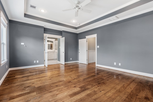 unfurnished bedroom with ornamental molding, hardwood / wood-style floors, ensuite bathroom, and ceiling fan