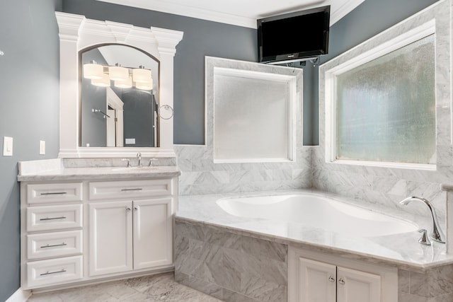 bathroom featuring vanity, ornamental molding, and tiled tub