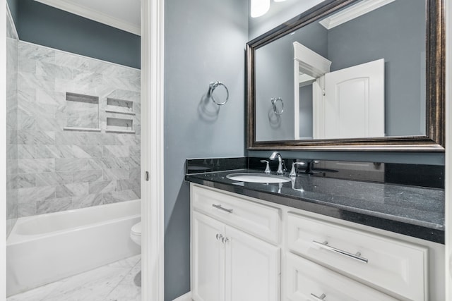 full bathroom featuring vanity, crown molding, tiled shower / bath combo, and toilet