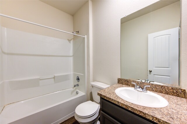 full bathroom featuring bathtub / shower combination, vanity, hardwood / wood-style floors, and toilet