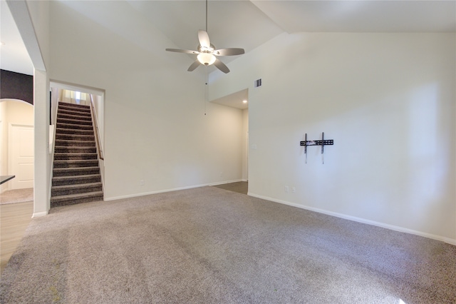 unfurnished living room featuring carpet flooring, high vaulted ceiling, and ceiling fan