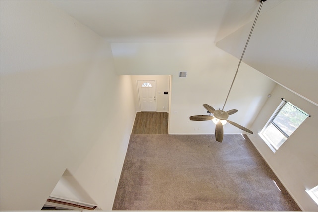 interior space with carpet and ceiling fan