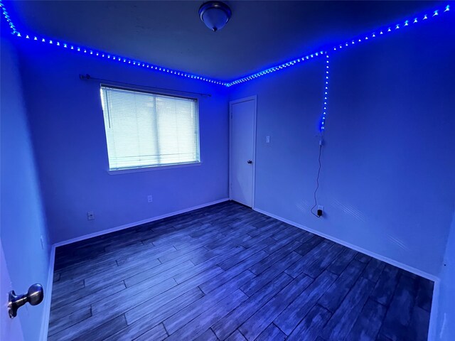 spare room featuring hardwood / wood-style flooring