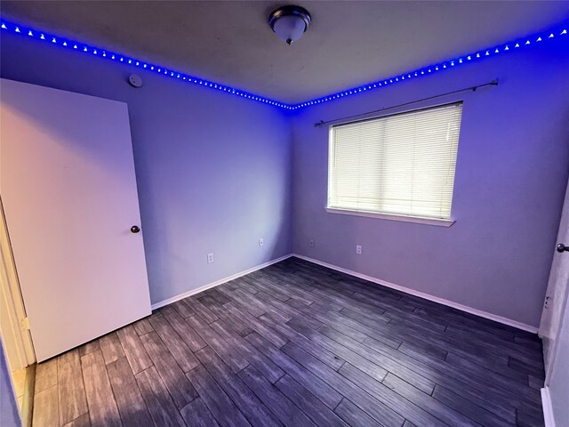 unfurnished room featuring wood-type flooring