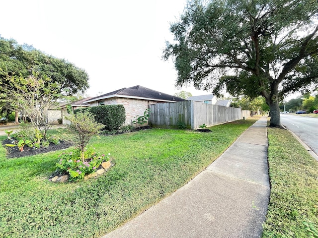 view of property exterior featuring a yard