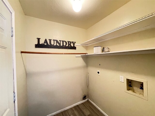 laundry area featuring hookup for an electric dryer, dark hardwood / wood-style floors, a textured ceiling, and washer hookup