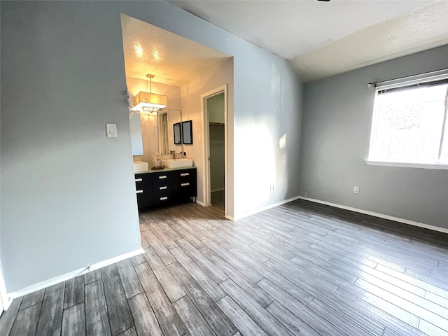 empty room with hardwood / wood-style flooring