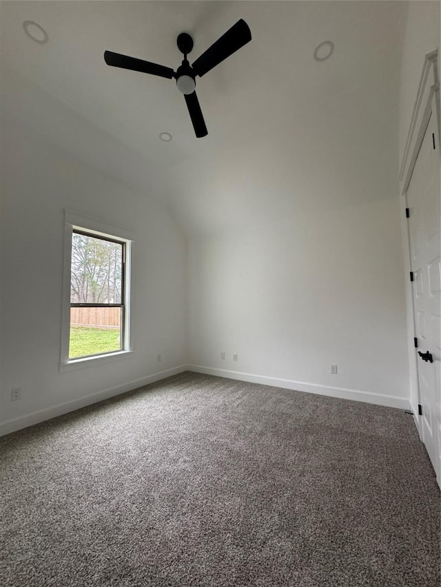 additional living space featuring lofted ceiling, carpet flooring, ceiling fan, and baseboards