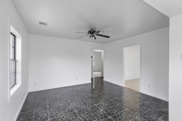 spare room featuring ceiling fan