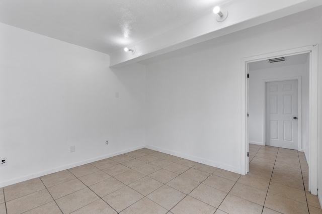 view of tiled spare room