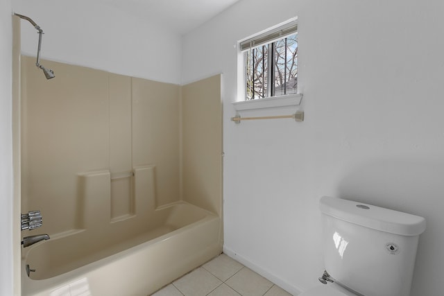 bathroom with toilet, tile patterned floors, and washtub / shower combination