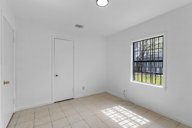 unfurnished bedroom featuring light tile patterned floors