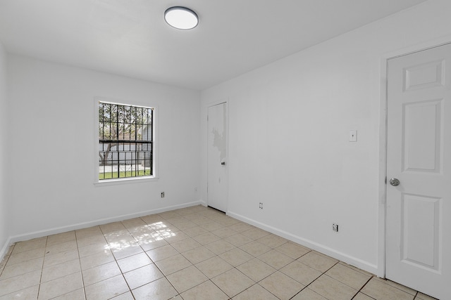 unfurnished room with light tile patterned floors