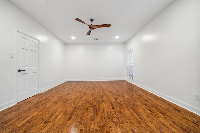 spare room with wood-type flooring and ceiling fan