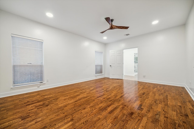 empty room featuring hardwood / wood-style floors and ceiling fan