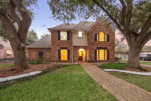 view of front of house with a lawn