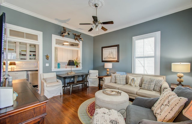 living room featuring ceiling fan, ornamental molding, and dark hardwood / wood-style floors