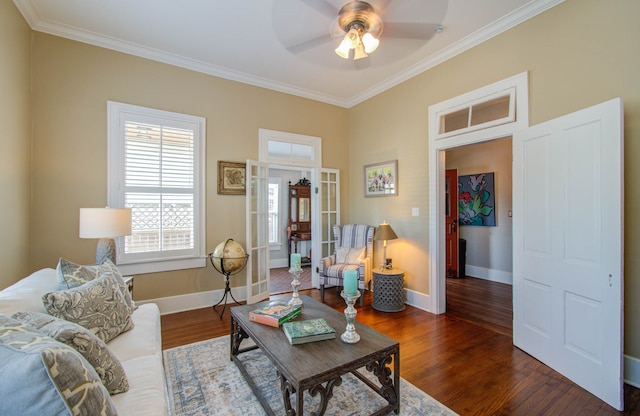 living room with ceiling fan, ornamental molding, and dark hardwood / wood-style flooring