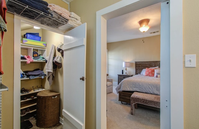 bedroom featuring light carpet