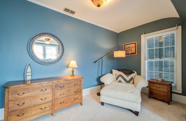 living area with light carpet and ceiling fan