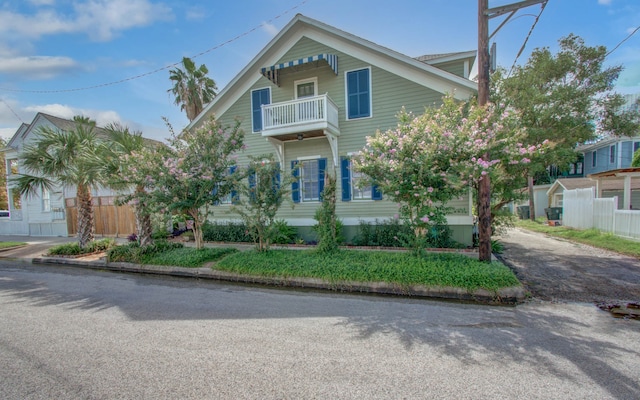 view of front of home with a balcony