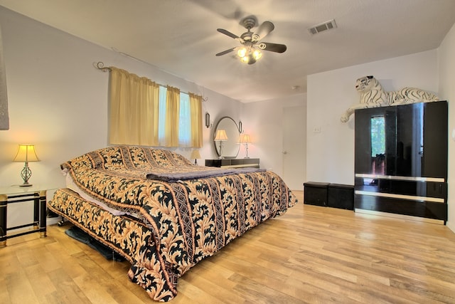 bedroom featuring hardwood / wood-style floors and ceiling fan