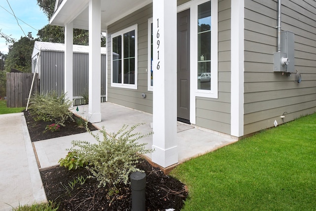 exterior space with a porch and a yard